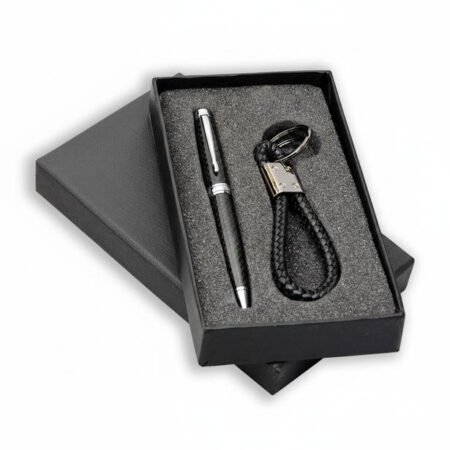 Boxed gift set containing a metal pen and a leather keychain